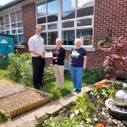 Cllr Ross-Shae and Cllr Gillian Thorne presenting a plaque to Fiona Meer, Co Headteacher at Low Ash Primary School